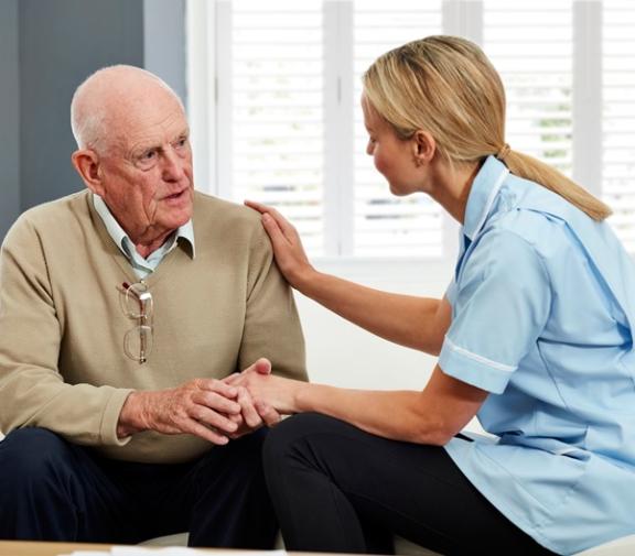 Older person with a medical professional