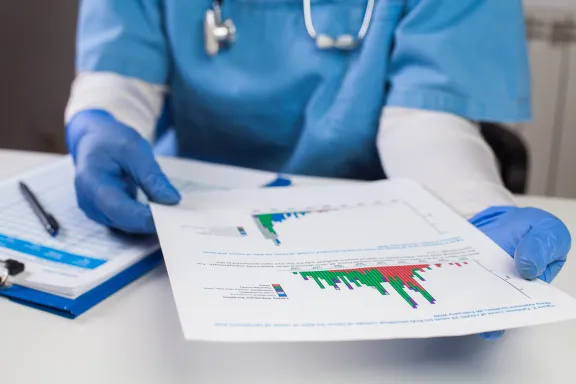 Image of a health professional looking at a chart