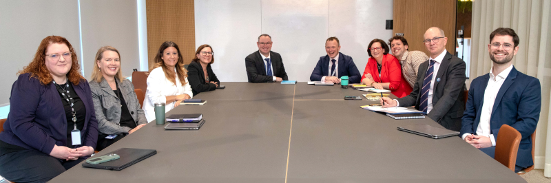 Group photo of staff from the interim Australian CDC with Dr Van Kerhove on 30 September 2024.
