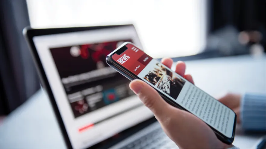 News cover image featuring the news on a laptop and mobile phone