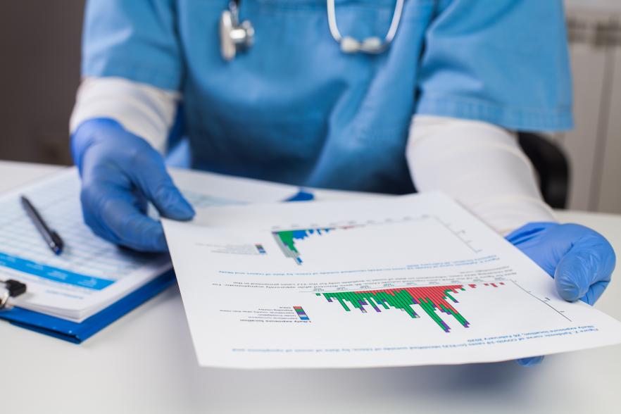 Image of a health professional looking at a chart
