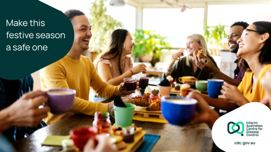 People enjoying a meal together with text reading "Make this festive season a safe one"