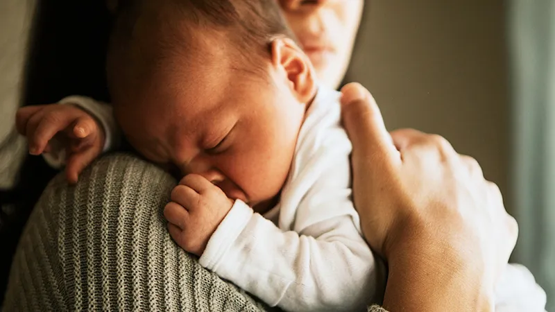 Image of a baby in parents arms
