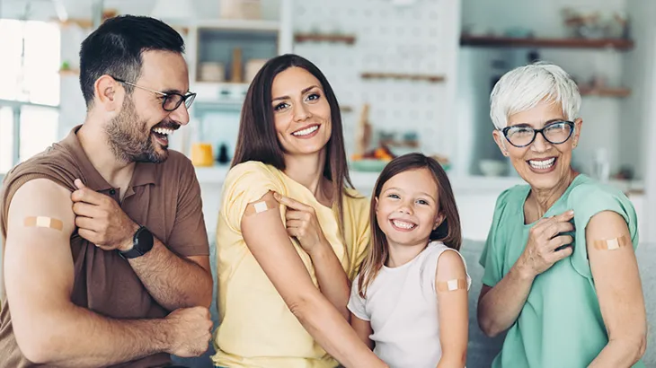 Cover image of different people showing their arms after getting vaccinated for the flu
