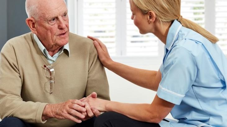 Older person with a medical professional